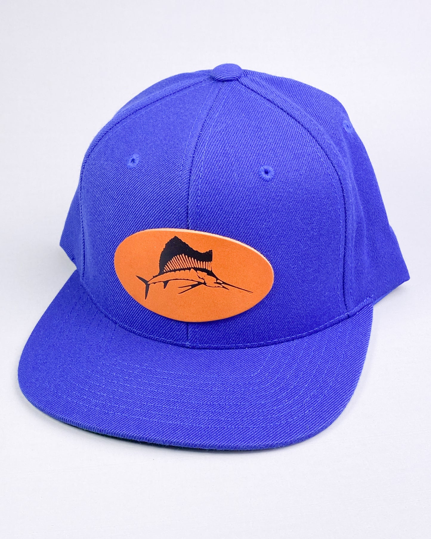 Bravo Premium hat in royal blue with sailfish design leather patch
