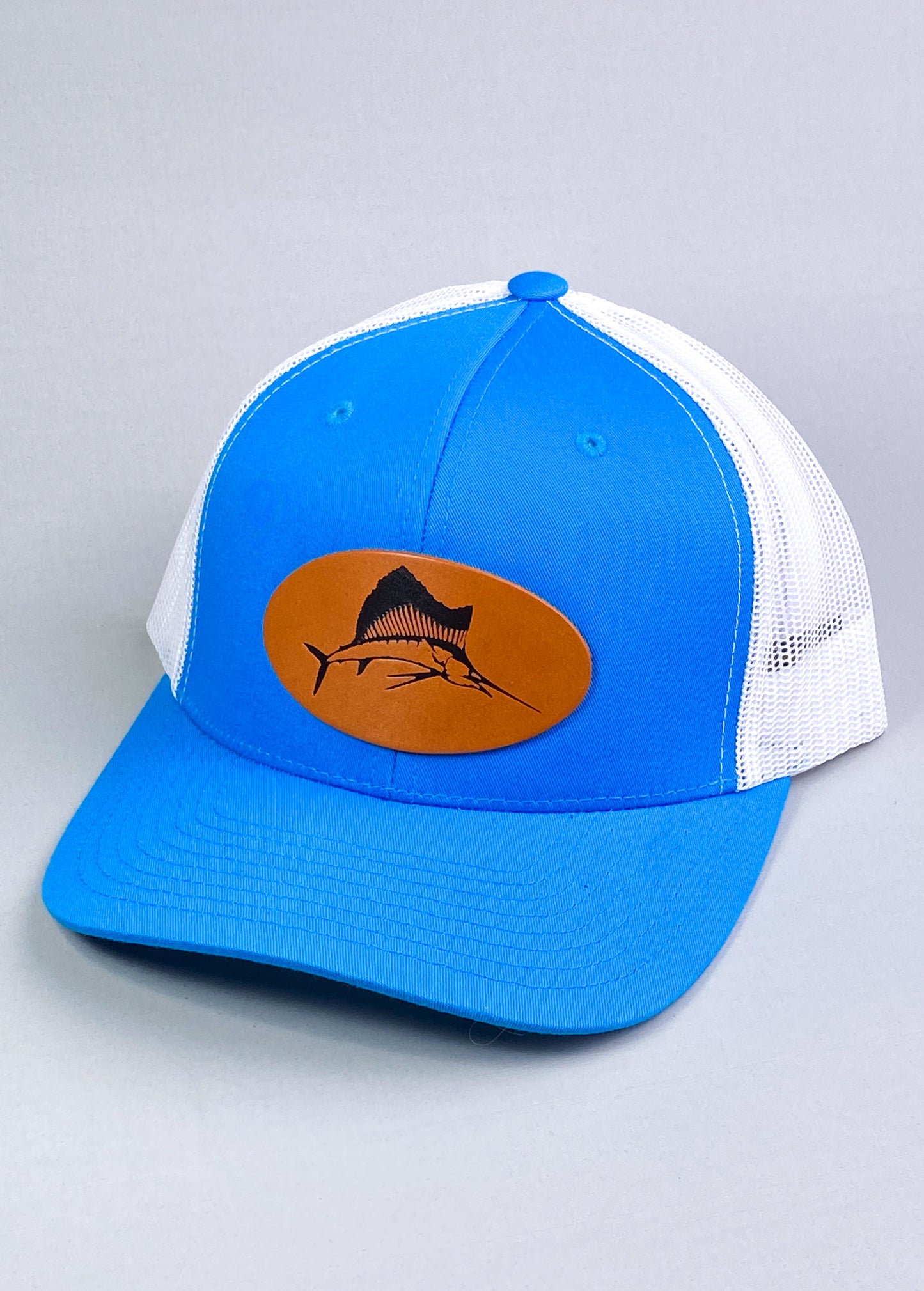 Bravo Premium hat in turquoise/white with sailfish design leather patch